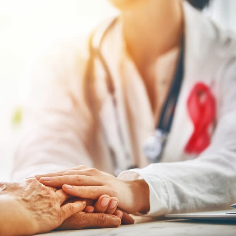 Doctor holding patient's hand