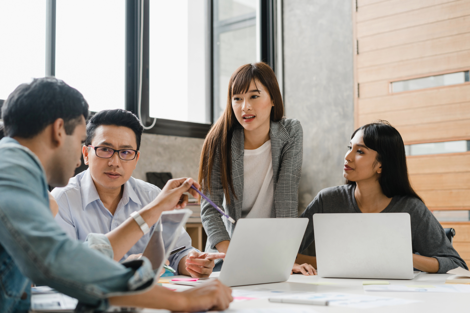 Employees discussing comprehensive health benefits at a startup.